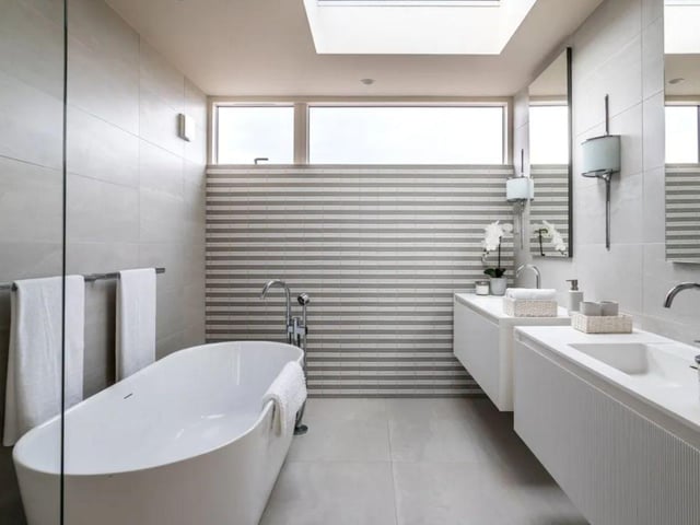 The listing says: "The accommodation, on three floors, is thoughtfully arranged to include two open-plan living and sitting areas, as well as a cosy snug to afford privacy. Three guest bedrooms and bathrooms are placed on the ground floor and have immediate access to the south facing deck and attractively landscaped gardens."