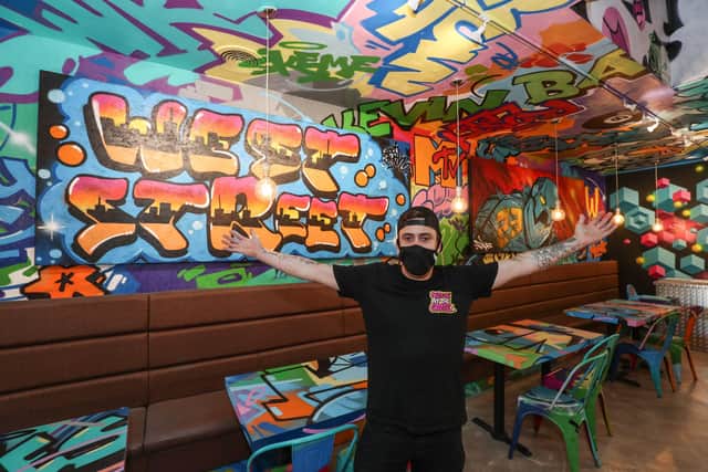 A look inside Bangerz 'n' Burgerz a new restaurant in Havant which has been decorated by local and international graffiti artists. General manager Ellis Bloy pictured in the new restaurant. Picture: Stuart Martin (220421-7042)