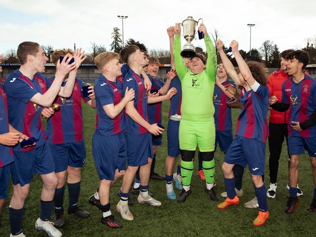 US Portsmouth keeper Harrison Hart lifts the silverware. Picture: Keith Woodland