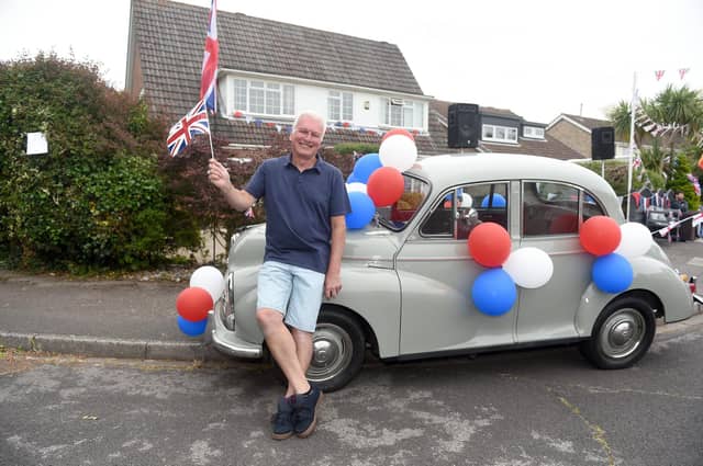 Residents in Hollam Close, Fareham, held a street party on Sunday June 5, to celebrate The Queen's Platinum Jubilee.
Pictured is: Derek Kelson (65) with his 1950's Morris Minor he bought recently with the Jubilee in mind.
Picture: Sarah Standing (050622-9657)