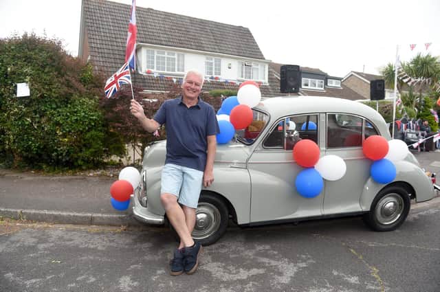 Residents in Hollam Close, Fareham, held a street party on Sunday June 5, to celebrate The Queen's Platinum Jubilee.
Pictured is: Derek Kelson (65) with his 1950's Morris Minor he bought recently with the Jubilee in mind.
Picture: Sarah Standing (050622-9657)