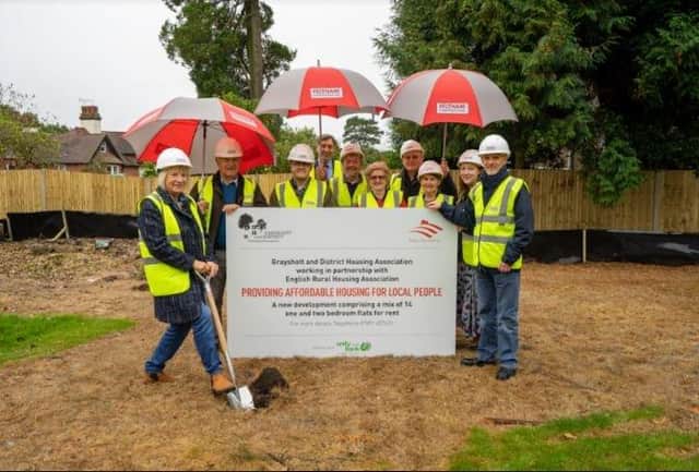 Charity representatives at the start of the affordable housing project.