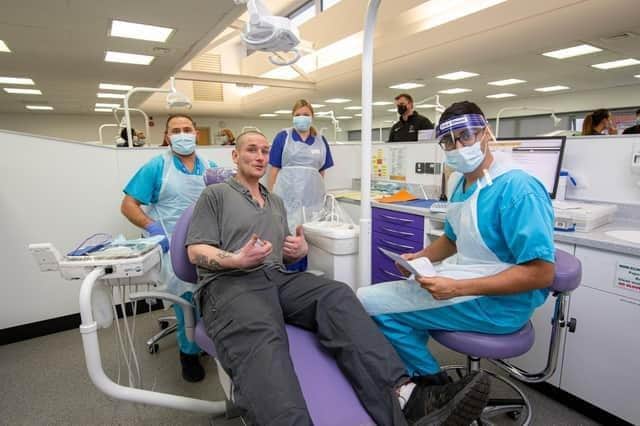 Dental students Mansoor Sadaat, Jay Bhardwa and Veronika Ramanauskaite with their patient, Don at University of Portsmouth Dental Academy, William Beatty Building, Portsmouth on Wednesday, December 15, 2021. Picture: Habibur Rahman