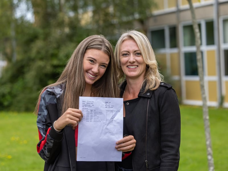 Harmony Bryan (16)  - who gained passes in English, maths and science - with proud mum Ella Bryan (39). Picture: Mike Cooter (240823)
