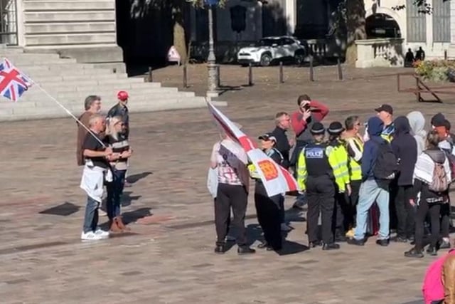 Police speak to protesters in Guildhall Square on Saturday morning