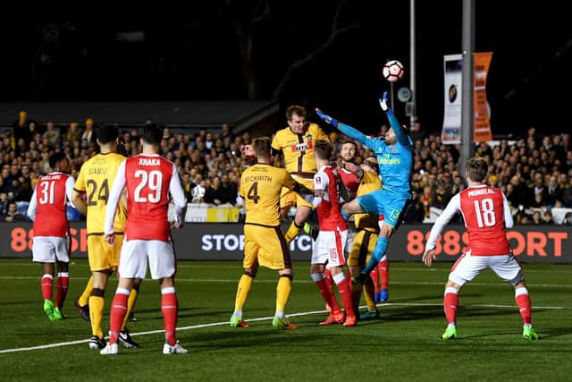 Jamie Collins rises high to get in a header during Sutton's FA Cup tie with Arsenal. Photo by Mike Hewitt/Getty Images.