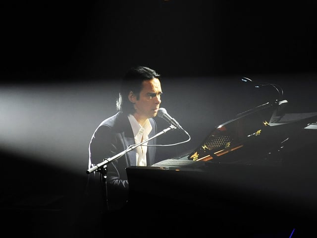At the piano