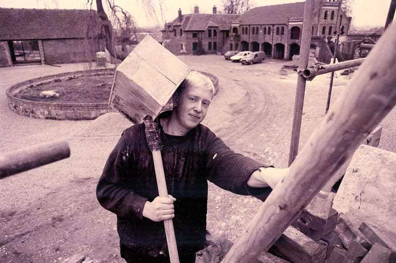 Labourer Mark Jackson from Funtington carries bricks to the team restoring the old Home Farm buildings at Cams Hall, Fareham in January 1993. The News PP116