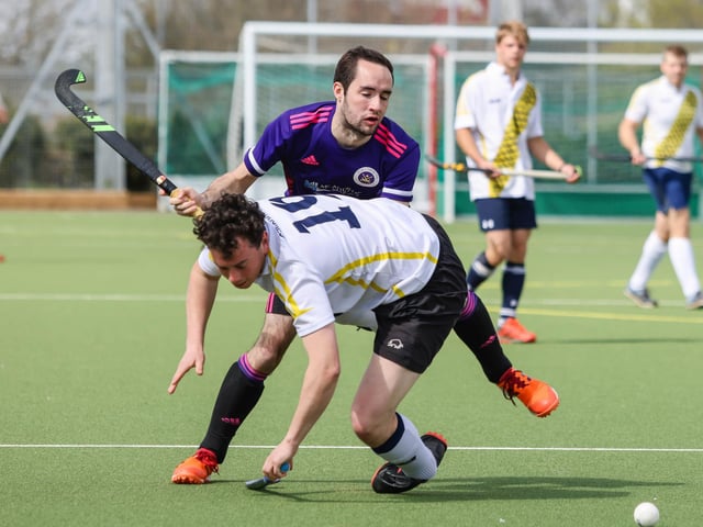 Portsmouth's Will Hartley is obstructed.
