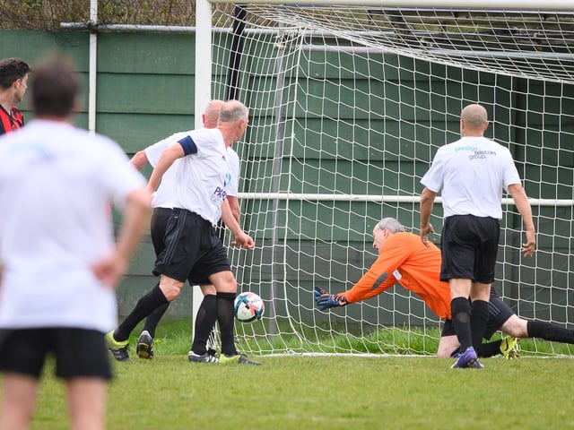 Action from the Jon Gittens memorial charity match between a team of former Fareham Town players and a side of ex-Pompey and Southampton professionals. Picture: Keith Woodland (160421-613)