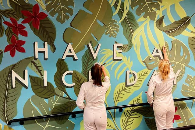 Lauren and Chloe creating a tropical mural.