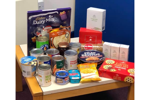 Gosport Voluntary Action has been supporting the community through its Close Encounters project. Pictured: Food to be put into a parcel