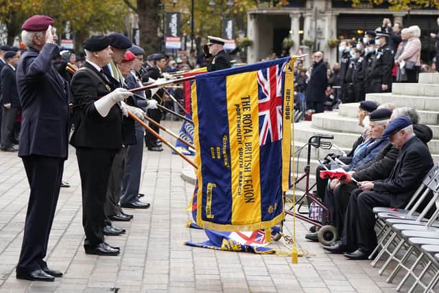 Standard bearers lower their standards during the Remembrance Service at the Guildhall Square, in Portsmouth. Picture date: Sunday November 14, 2021.