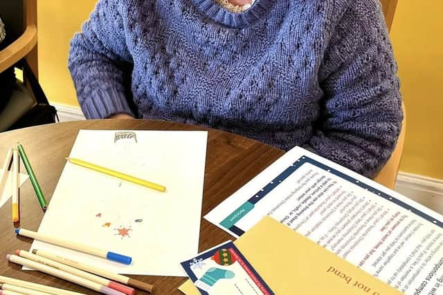 A resident enjoys a Christmas letter from a fellow resident