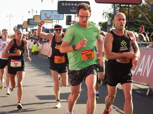 Pictured is: Runners cross the line to finishPicture: Keith Woodland (151021-591)
