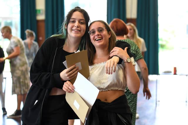 Elizabeth Law, 16, left, with Sophie Roper, 16, who got five 8s and four 7s. She's staying at the sixth form to study for her A-levels
Picture: Paul Jacobs/pictureexclusive.com