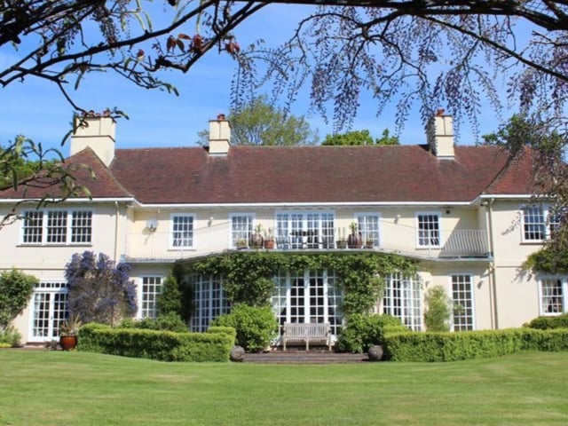 This home has 12 bedrooms, 11 bathrooms and five reception rooms and it is situated in a beautiful area of the countryside.