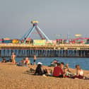 People enjoy the evening sunshine on Southsea beach.
(Photo by Finnbarr Webster/Getty Images)