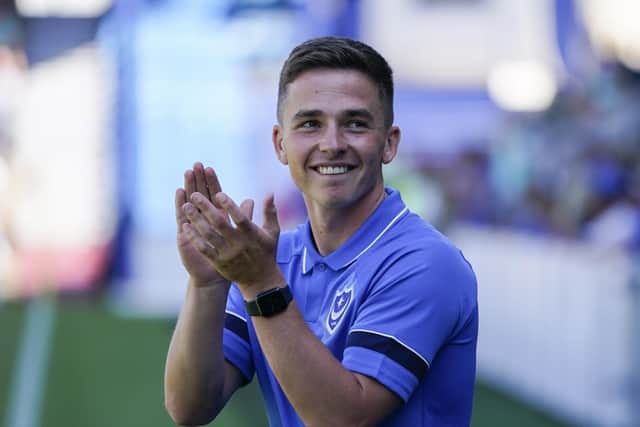 Pompey new-boy Tom Lowery applauds the Fratton faithful after being introduced before Saturday's clash with Lincoln. Picture: Jason Brown
