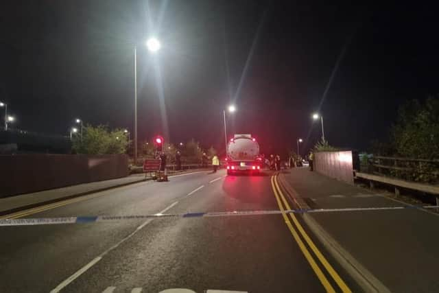 Police close the road during a demonstration by environmental campaigners, preventing copies of The News leaving for Portsmouth from the print plant in Thurrock