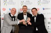 Craig Gordon and Michael Frisby of Vuzion UK with editor of The News Mark Waldron at the Business Excellence Awards 2021