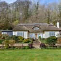 This four bedroom detached house in Hambledon is on sale for £1,895,000. It is listed by Fine and Country