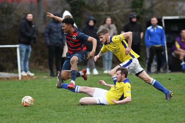 Finn Bello (red/blue) is one of the Portchester U23 players who have helped bring 'a buzz' back to Paulsgrove.
Picture: Neil Marshall