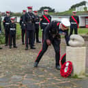 Brigadier Sean Brady lays a wreath. Picture: Mike Cooter (111222)
