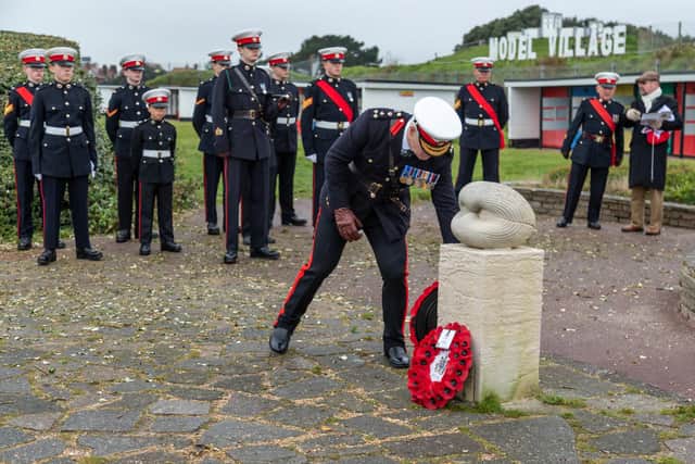 Brigadier Sean Brady lays a wreath. Picture: Mike Cooter (111222)