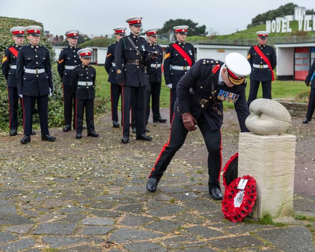Brigadier Sean Brady lays a wreath. Picture: Mike Cooter (111222)