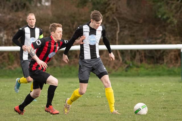 Harry Frost, right, in action for Hayling against Locks Heath - the teenager won both the committee's player of the season award and the players' player of the season honour. Picture: Keith Woodland