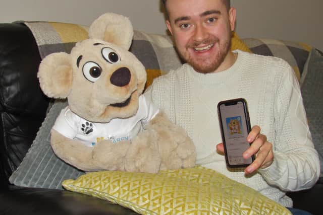 Tom Ingram with The Karen Ingram Foundation mascot Muddles the bear
