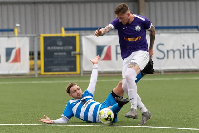 Copnor's Bradley Hartill, left, is fouled by Jordan Camburn. Picture: Keith Woodland