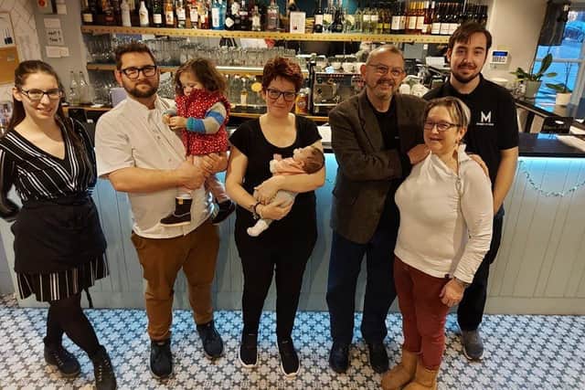 Sara Pollard-Dambach and her partner Oli Dambach, centre, with staff from McDambi's in Fareham