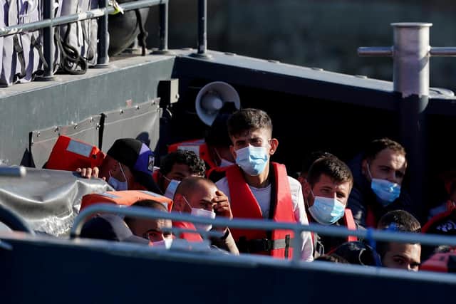 File photo dated 08/08/22 of a group of people thought to be migrants are brought in to Dover, Kent, from a Border Force vessel following a small boat incident in the Channel Photo: PA