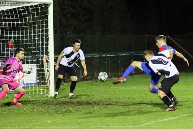 Ethan Quinlan scores Fareham Town's winner at Alresford on his first Wessex start for the club. Picture by Ken Walker