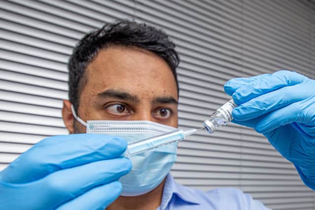 Krishan Patel with the Covid vaccine at Goldchem pharmacy, Southsea Picture: Habibur Rahman