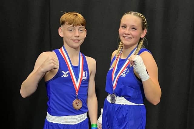 Lord Mountbatten BC pairing of Oliver Wells, left, and Madison Stubbington-Bartlett with their respective bronze and silver Three Nations medals on display