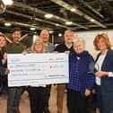 Portsmouth Business Networking Event organiser Penny Pilmoor, along with business owners Phil Mundy, Patricia Wakeford, Chris Handley, Lincoln Noel, Gayle Tong and Fiona Heath presented a cheque to Luke Knight of Dementia Support for £4521. Photos By Alex Shute