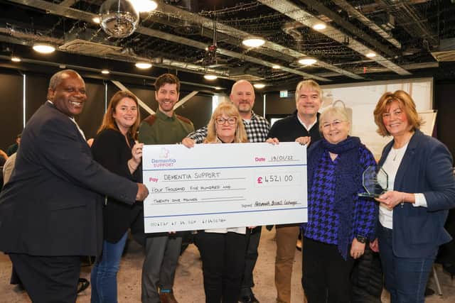 Portsmouth Business Networking Event organiser Penny Pilmoor, along with business owners Phil Mundy, Patricia Wakeford, Chris Handley, Lincoln Noel, Gayle Tong and Fiona Heath presented a cheque to Luke Knight of Dementia Support for £4521. Photos By Alex Shute