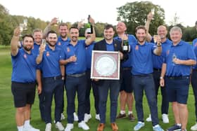 Lawrence Cherry holds the Daily Telegraph Salver after his Hampshire team celebrate winning the South East League Final. Picture by Andrew Griffin.