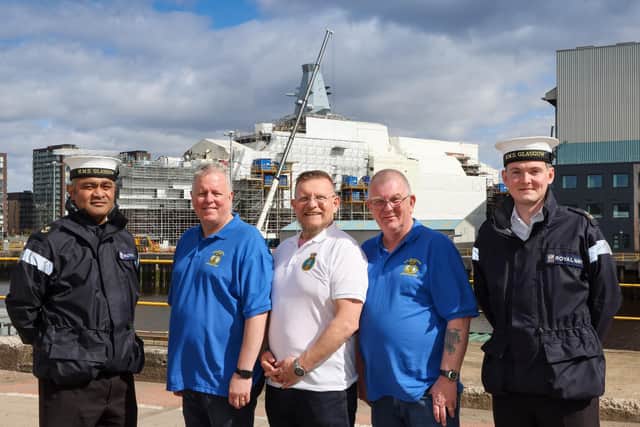 Veterans who served on the former HMS Glasgow during the Falklands war are pictured in front of the  new frigate bearing the Scottish city's name. They are flanked by serving sailors from the Royal Navy based on the new frigate.