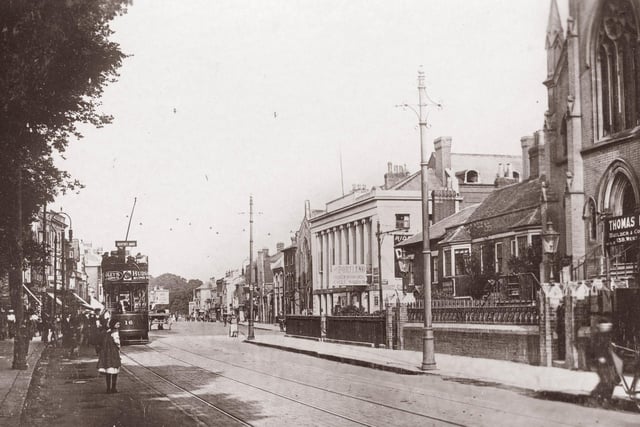 Busy as people board the tram on the left, in West Street, Fareham