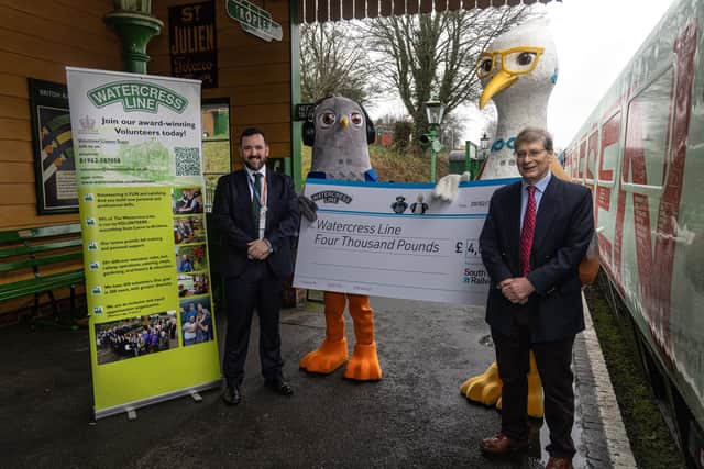 South Western Railway mascots Wes and Sandy with Tom Desmond, Operations Director at Network Rail, left, and Stephen Evans, Chair of The Watercress Line Heritage Railway Trust.