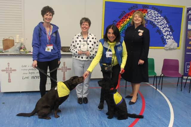 Pictured: (left to right) Representatives from the charity Pets for Therapy with dogs Mia and Jett; Mrs Wendy Mitchell, Acting Headteacher at Newtown and Deputy Lieutenant, Bella Birdwood, representing HM King Charles III.
Picture credit: Newtown C of E Primary School