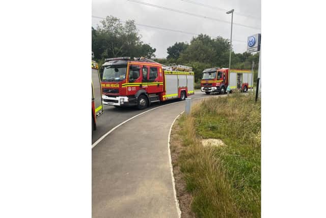 Three fire engines attended the scene to stage a controlled venting of a package leaking an unknown gas.