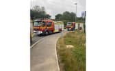 Three fire engines attended the scene to stage a controlled venting of a package leaking an unknown gas.