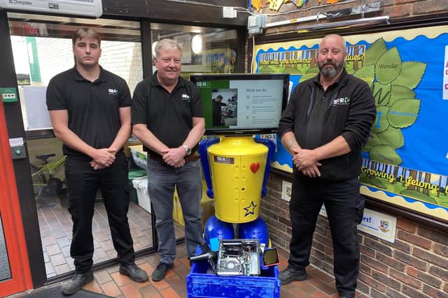 Boddy Thew, Gary Dalton and David Edwards from Hilsea-based Southern Electrical Recycling at Bosmere Junior School in Havant.