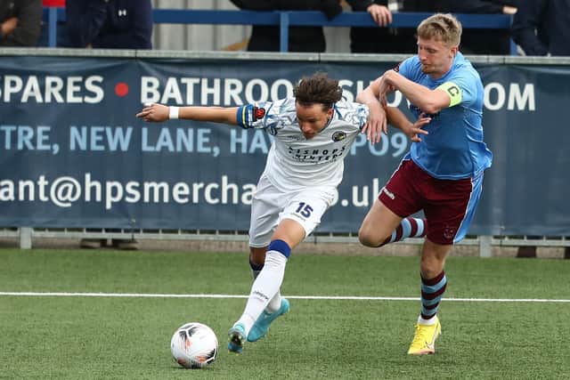 Hawks sub Tomas Kalinauskas wins the ball from Weymouth's Xander McBurnie. Picture by Dave Haines