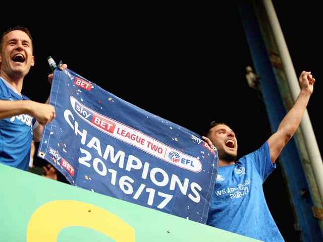 Gareth Evans and Michael Doyle celebrate Pompey taking the League Two title - and outcome Evans felt sparked long-held animosity from Derek Adams. Picture: Harry Murphy/Getty Images